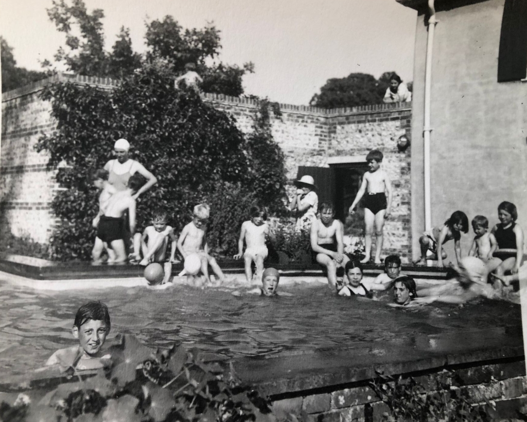 Children playing in an outdoor swimming pool