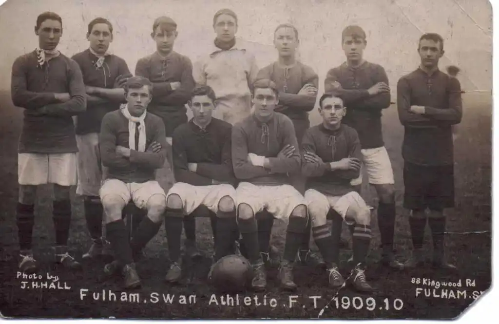 Black and white postcard photo by JH Hall of 88 Kingswood Road, Fulham, Swan Athletic Football Team, 1909-1910 showing 11 young men posing as a team in football gear. Ted Mayhew is L/H side back row.