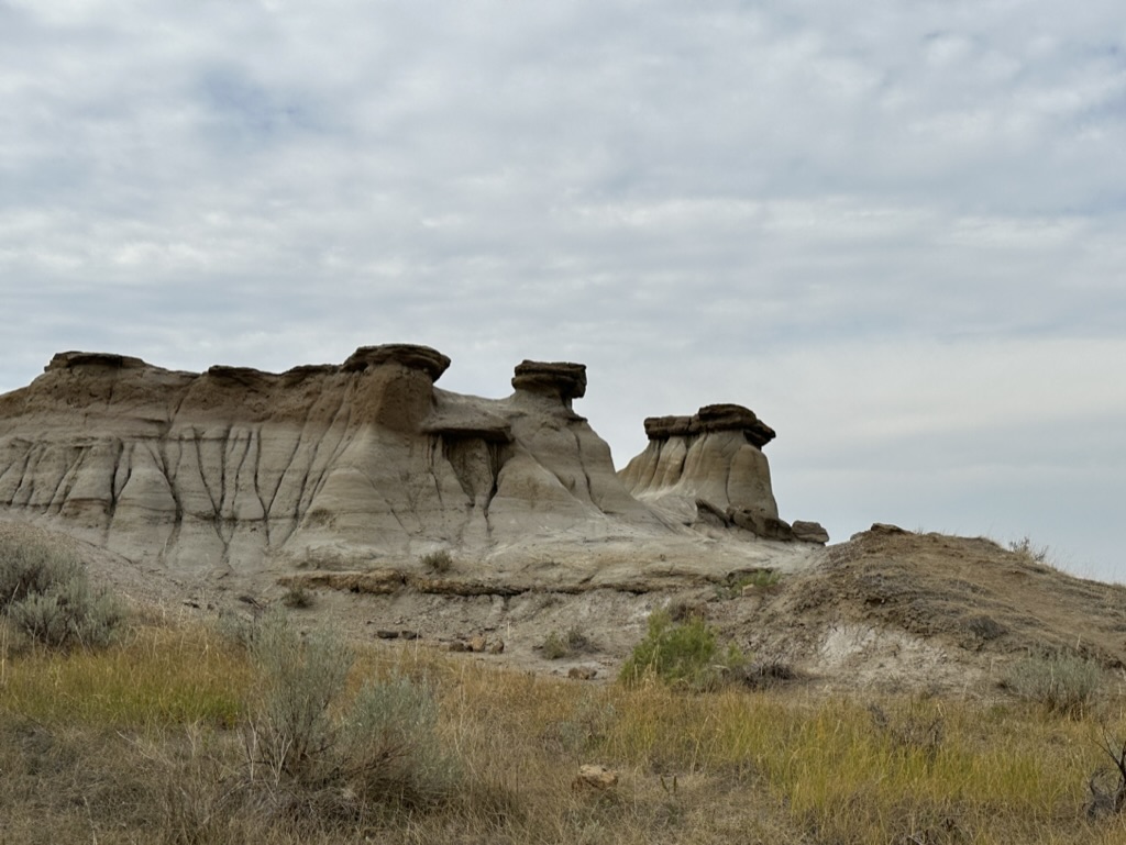 Image of 'hoodoos' a rock formation made of sandstone capped with a rock in the middle of the Dinosaur Provincial Park, Alberta, Canada