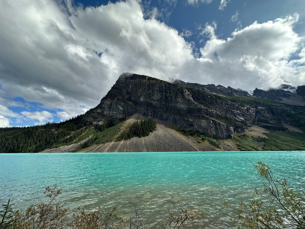 The turquoise waters of Lake Louise with mountains in the background
